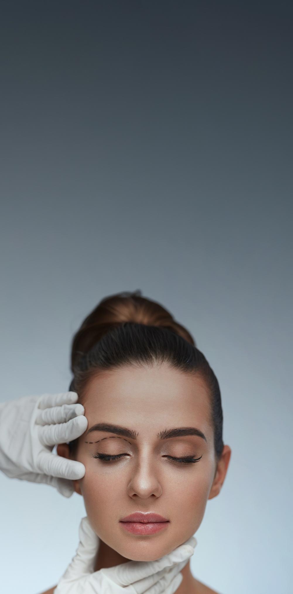 womans face being touched by gloved hands